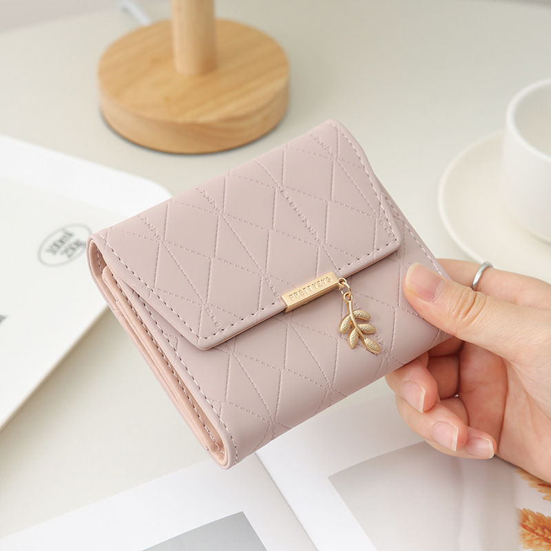 2024 Purse women's short high-end boutique fashion personality hardware leaf buckle short three fold bag multi-card folding stud