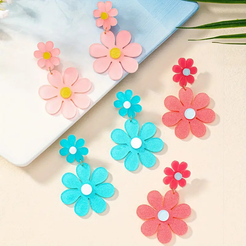 A pair of long, fashionable, personalized, sweet, and large flower earrings as a for daily accessories