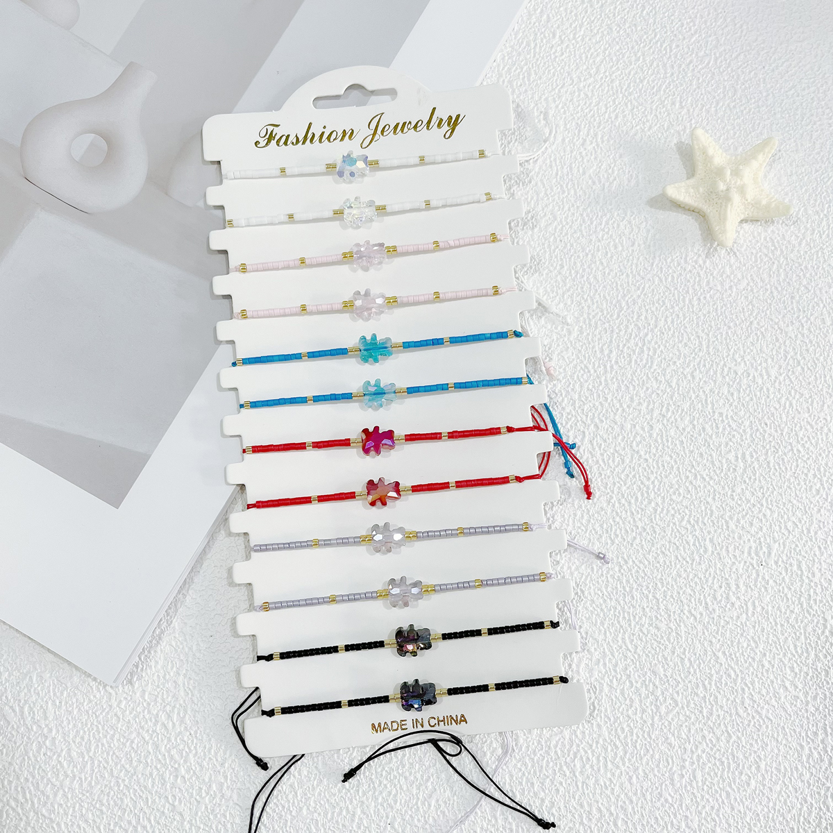 A 12-piece set of colorful rice bead beaded woven fashionable and cute little bear boy and girl adjustable bracelet