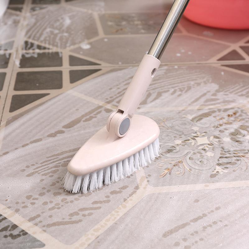 A long handled hard bristled triangular floor brush, bathroom tile gap cleaning brush