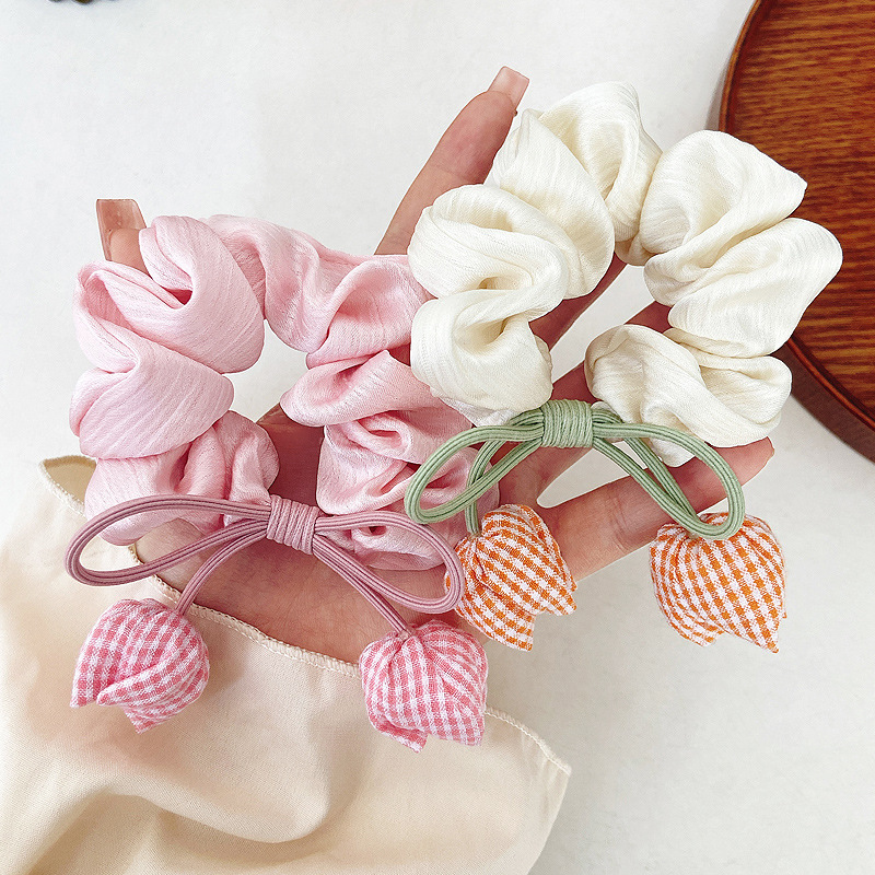 1 piece of tulip-shaped hair elastic for women, suitable for ponytails and hair ties, with a bow decoration.