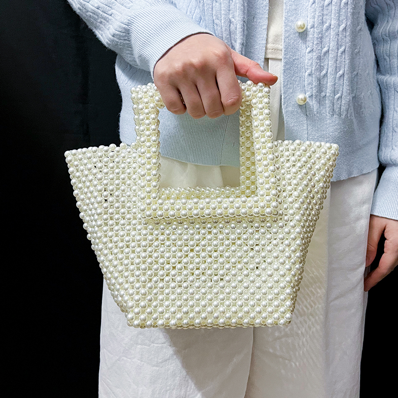 New imitation pearl handmade bead woven mobile phone bag for women, gentle French style handheld niche bag ins