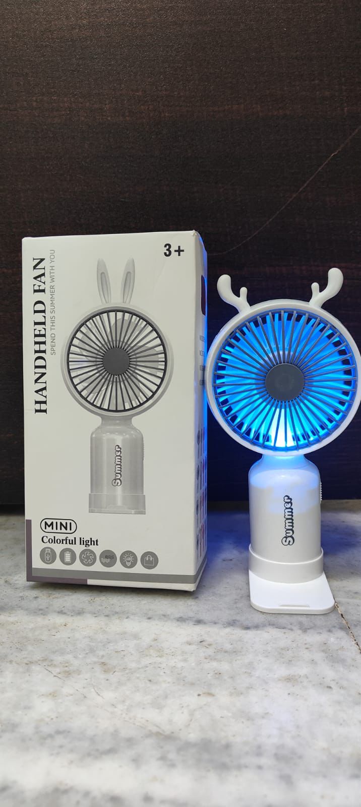 USB Rechargeable Mini Portable Fan come with 2 Speed Mood, 7 Different Light Use For Office/Market/Travel with Base, 1hr Battery Backup (Multicolor)