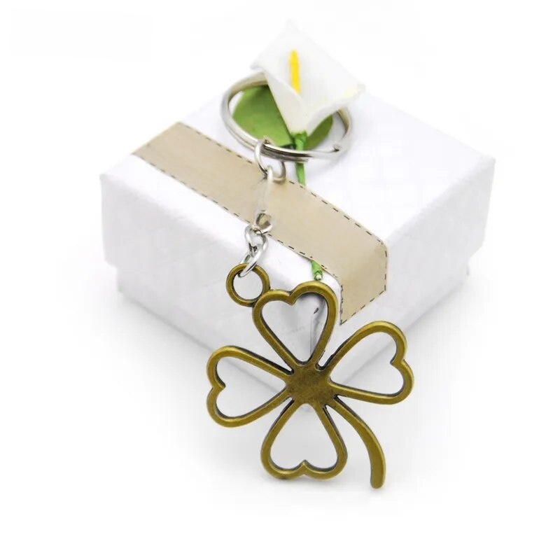 Sutuiying 【ZOETN-HOT TOY Store】Original New Fashion Lucky Leaves Clover Key Sales promotion Chains Bag Buckle For Car Keyrings KeyChains Women Jewelry Men