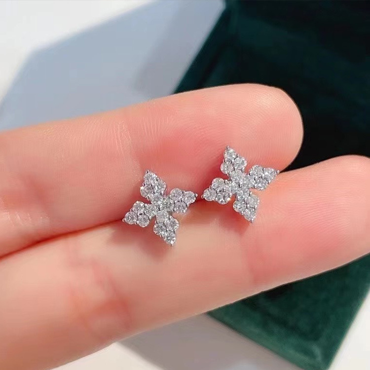 Live broadcast hot selling earrings wholesale simple temperament elegant white gold four-leaf flower slightly inlaid zircon cross stud earrings girl