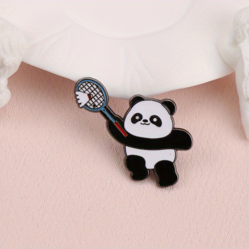 Adorable Panda with Badminton Racket Enamel Pin Sporty Cartoon Panda Brooch for Badminton Lovers Cute Lapel Pin Panda Playing Badminton Design Suitable for Those Who Love Panda Elements and Sports. It Can Be Pinned on Clothes or Backpacks