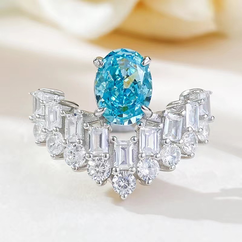 【Innovative designs】Seiko Sea Blue Zirconium Ice Flower Cut Ring Light Luxury V-Shaped Pigeon Egg Glacier Blue Crown Women