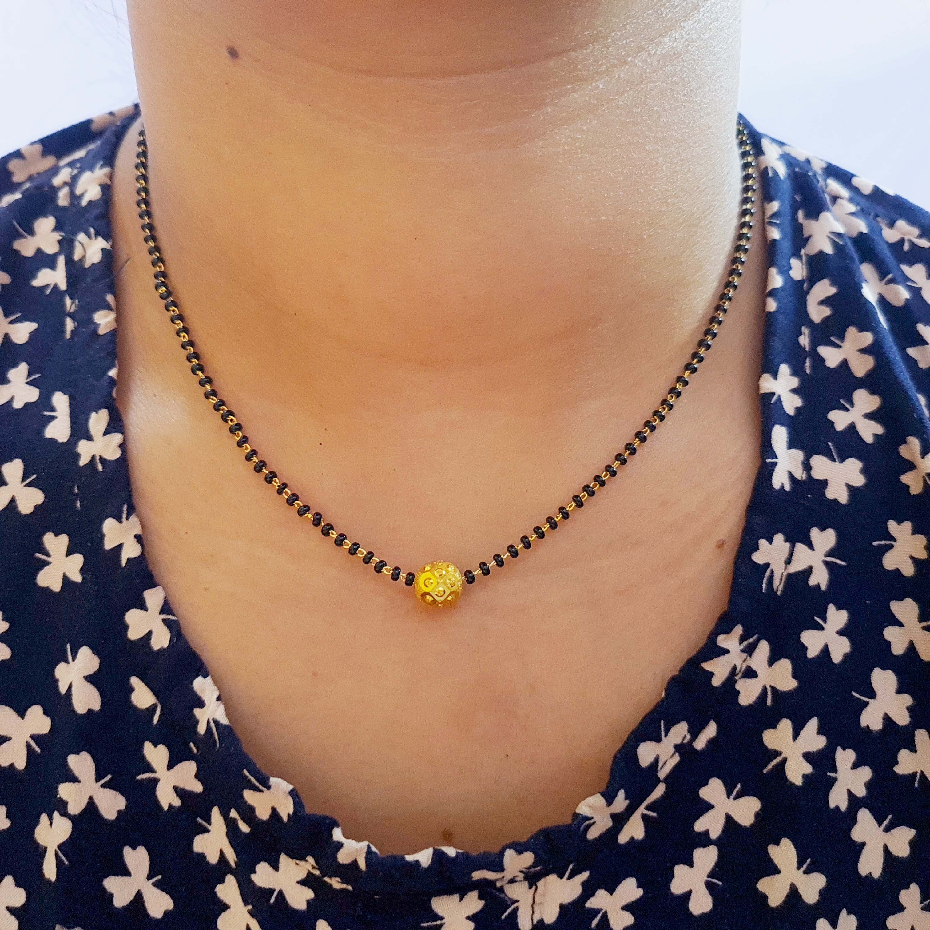 Gold Plated Ball Pendant Design Mangalsutra With Black Beads Lari Chain Single Ball Mangalsutra One Ball Mangalsutra Golden Ball Mangalsutra Simple Mangalsutra Offer Mangalsutra For Daily Use Attractive Mangalsutra Design Beautiful Mangalsutra For Mother