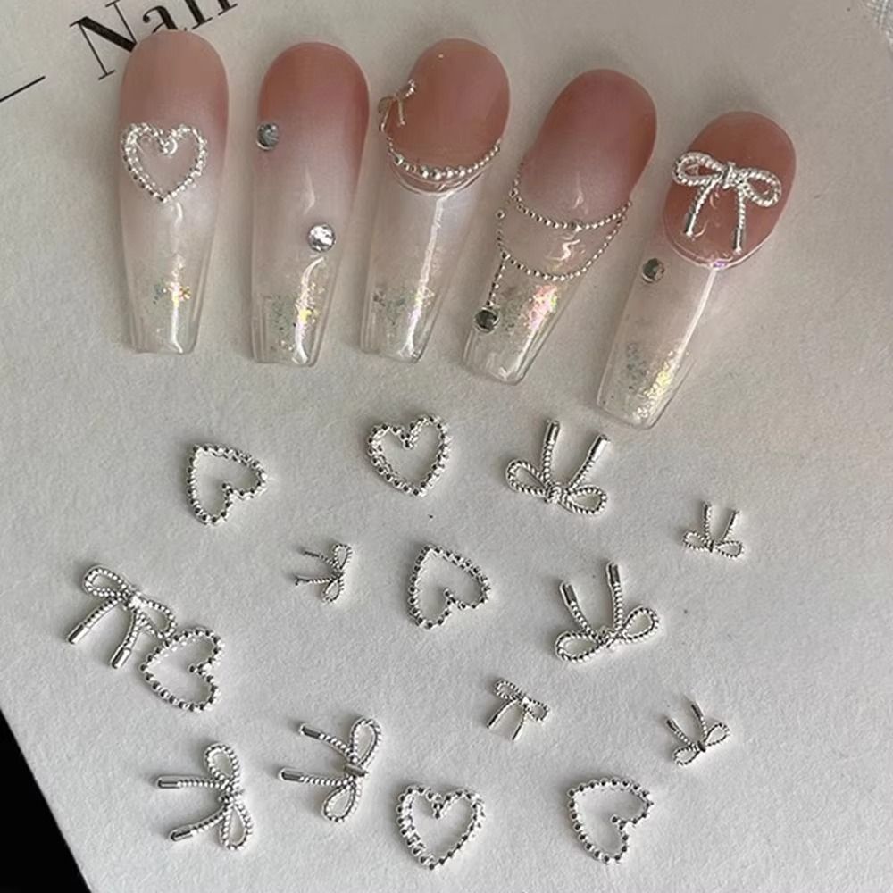 10Pcs/Bag Cute Mini Bowknot Nail Art Charms Alloy Super Shiny Nail Art Decorations Silver Metal Manicure Accessories DIY Manicure Designs Supplies