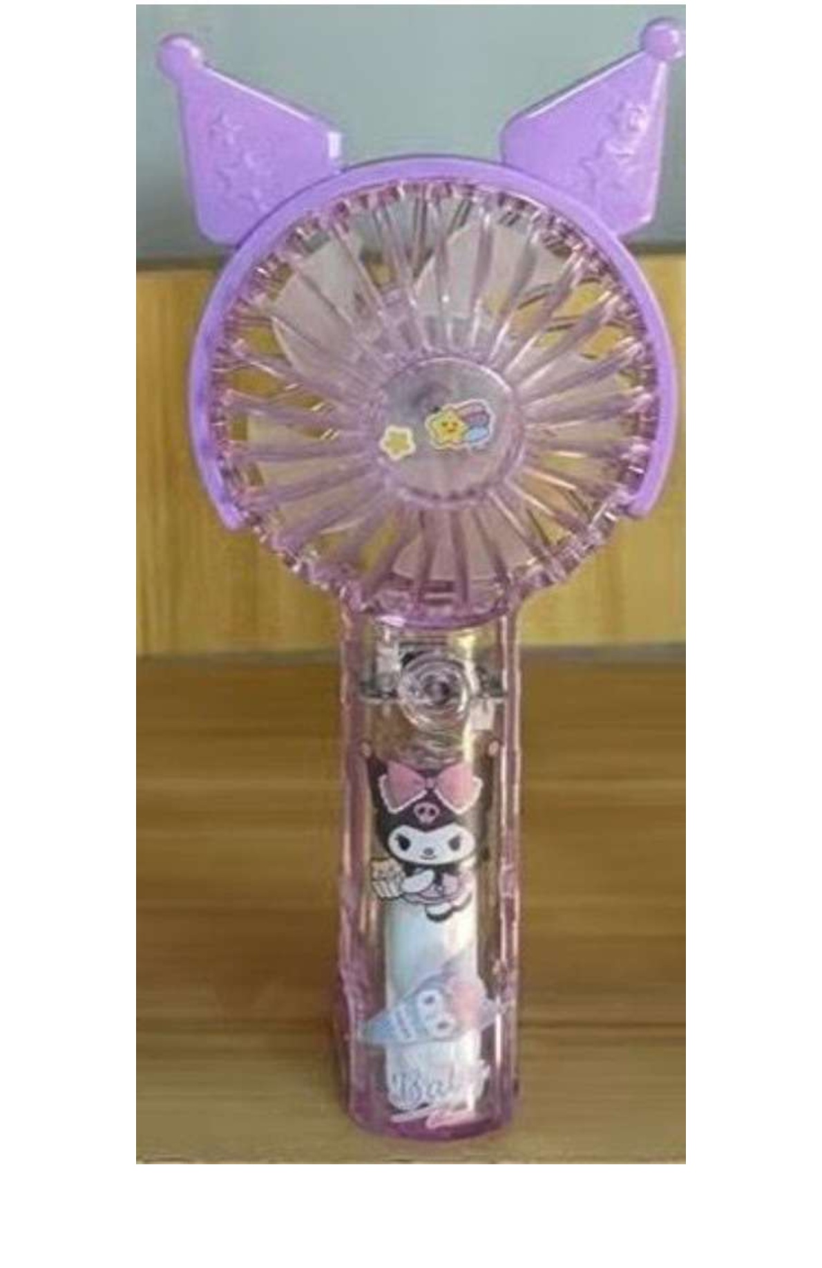 Kuromi handheld mini fan, featuring cartoon character ears on the fan head.