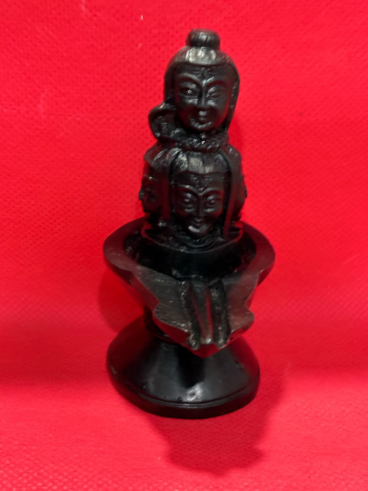 Three-faced Shiva Lingam (Mukhalinga), a sacred representation of Lord Shiva in Hinduism