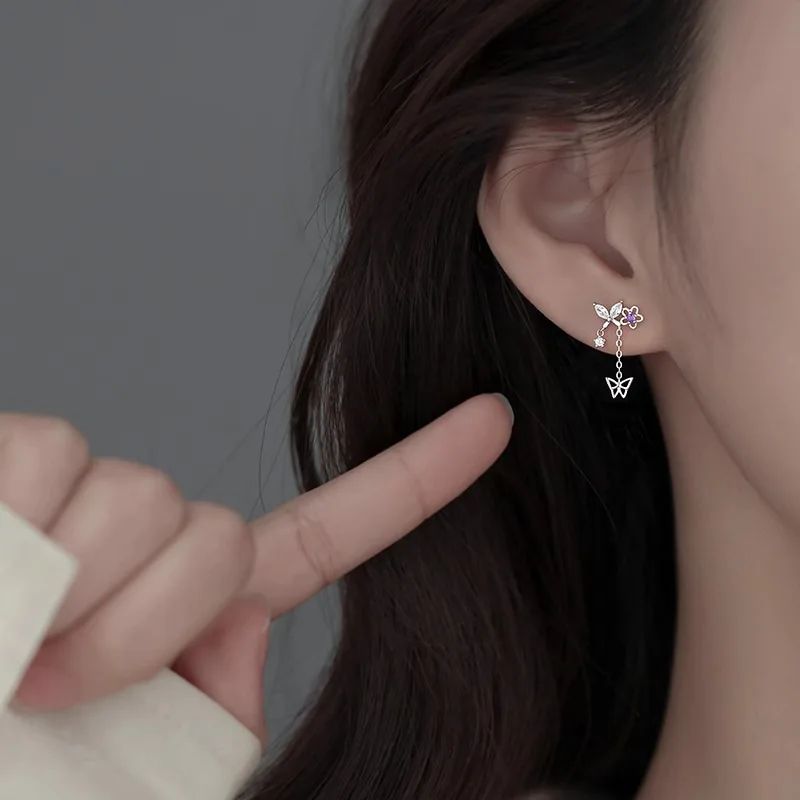 Ventfille 925 Sterling Silver Flower Earrings - Elegant zircon-accented earrings featuring delicate butterfly tassels and a hollow-out floral design